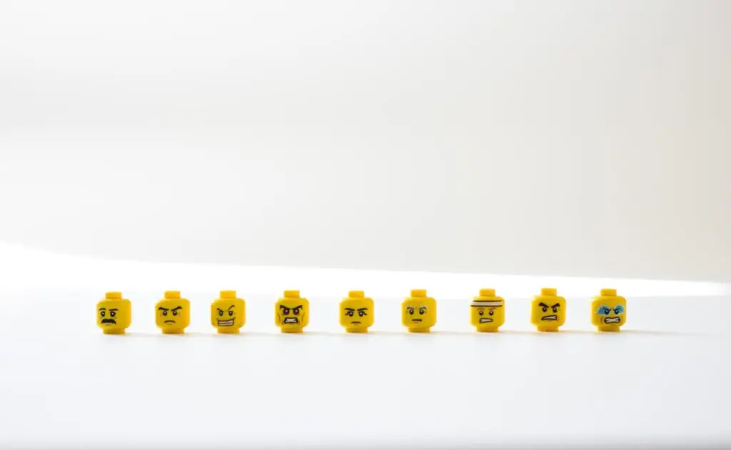 handling negative comments - lego heads with angry faces all in a line